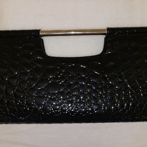 Patten leather clutch